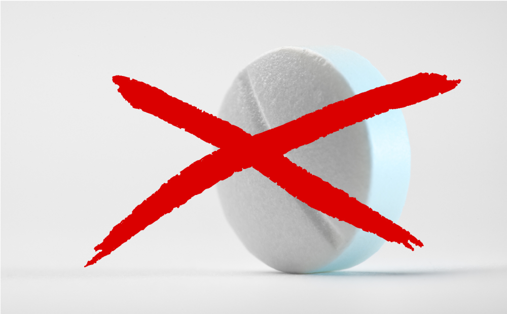 a white pill with a red x