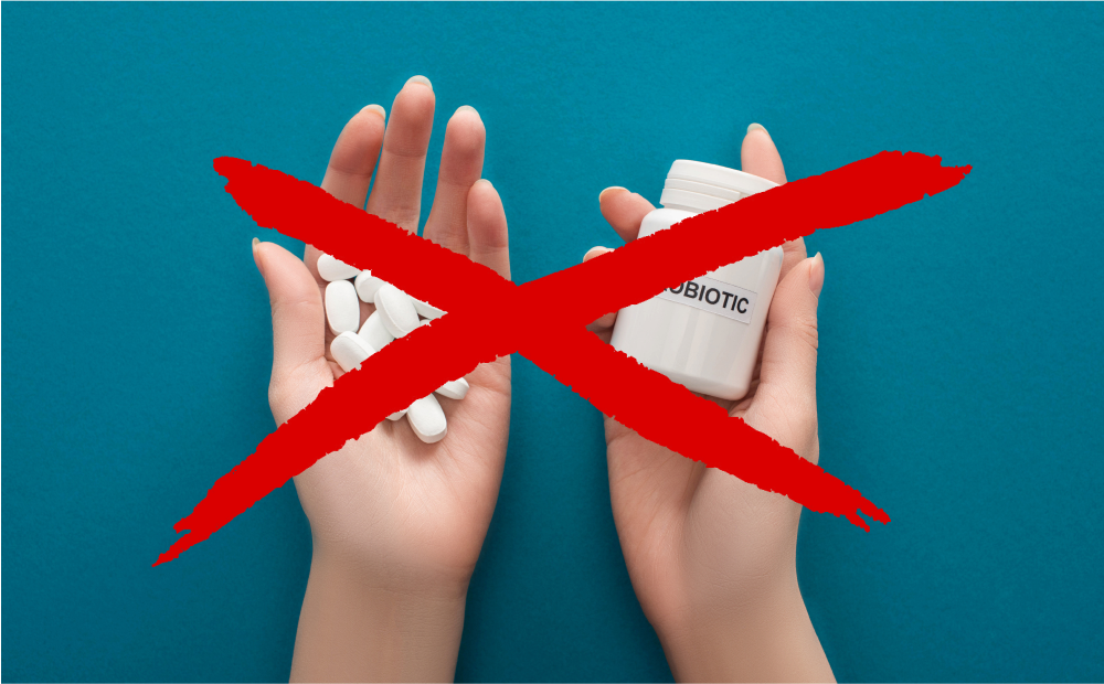 a hands holding a bottle of pills