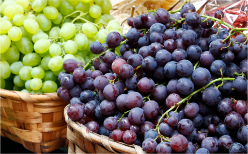 a group of grapes in baskets